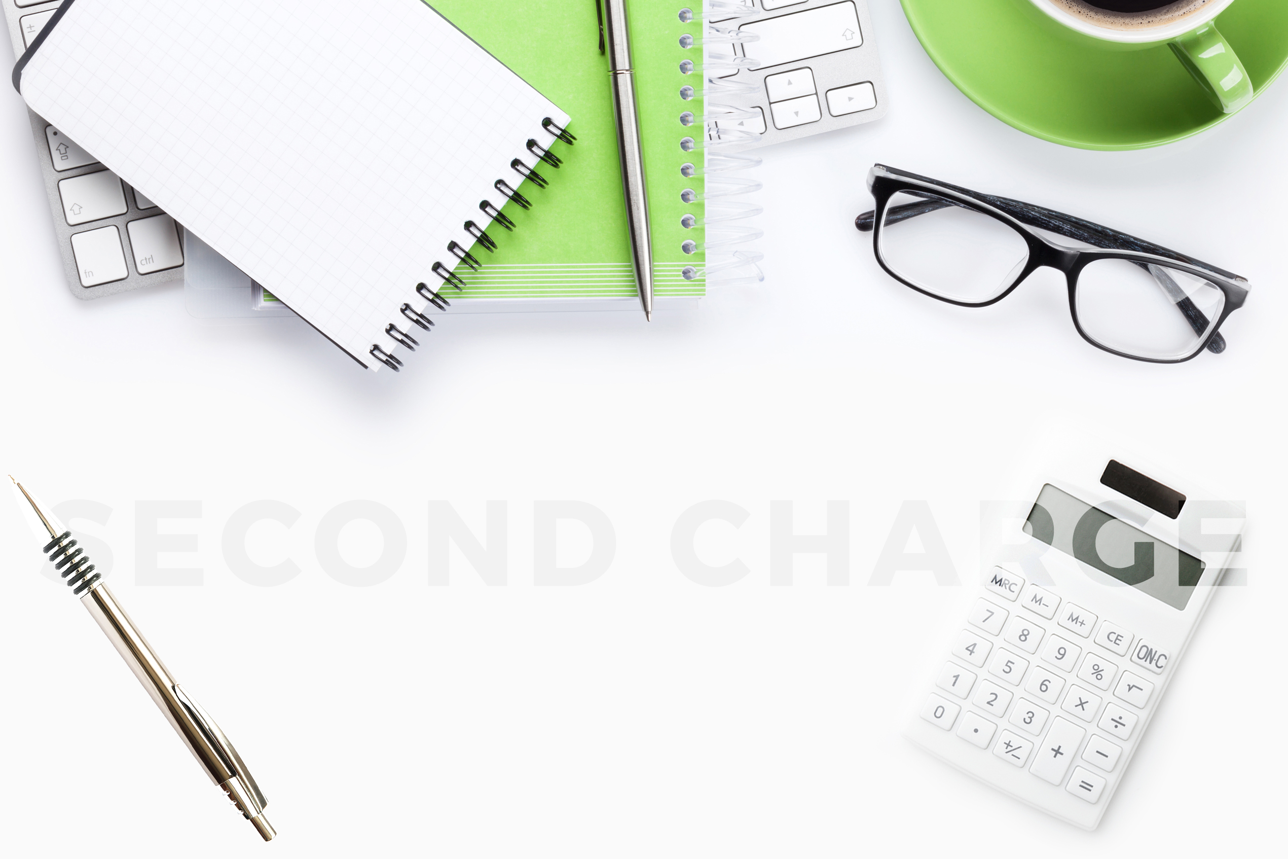 White background with stationary and glasses and the words second charge
